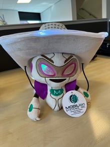 Robot plushie wearing a Stetson hat